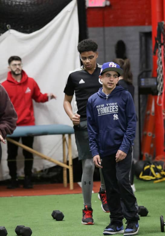 A youth athlete engages in strength and conditioning