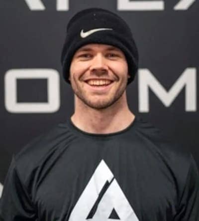 Nutrition Coach Dion Lynch smiling in apex apparel.