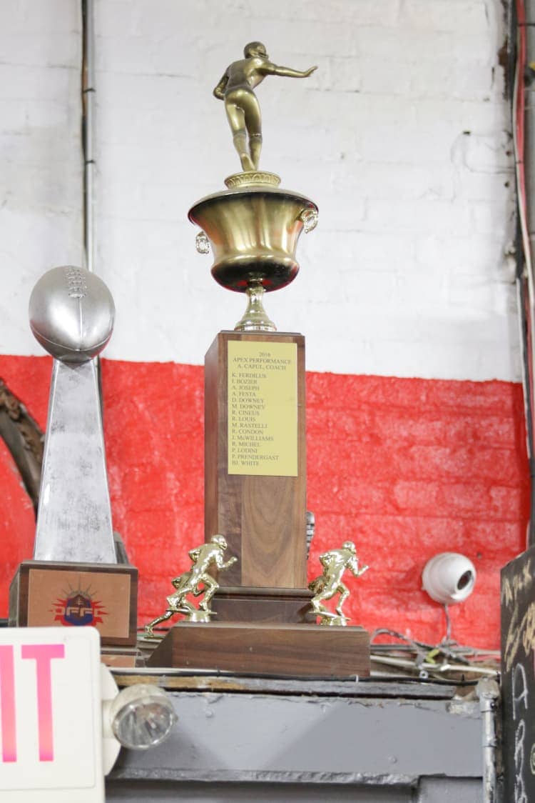 Apex Performance Gym's championship trophy, a testament to the gym's successful training programs and athletic mentorship.